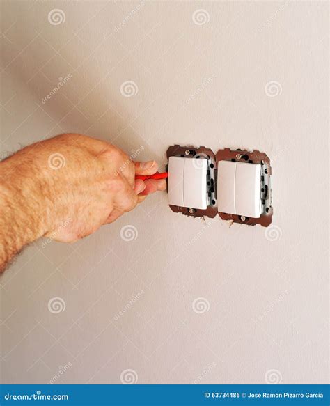 Electrician Installing Electrical Switches in the New House Stock Photo - Image of connecting ...