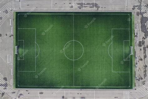 Premium Photo | Large green football field at stadium closeup