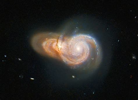 Hubble Space Telescope Captures Dazzling Image of Two Overlapping Spiral Galaxies - TechEBlog