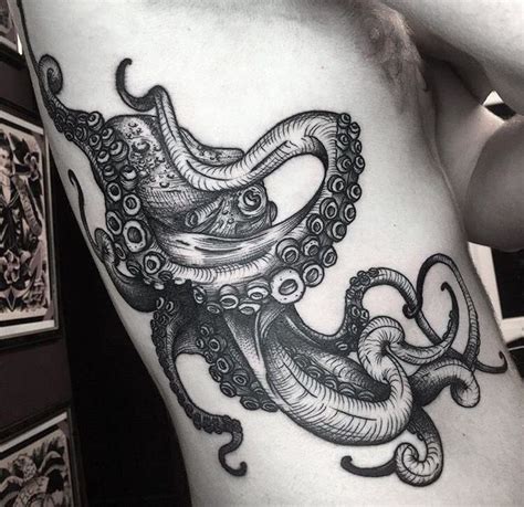 Octopus tattoo. amazing chest/under arm nautical tattoo done with simple black ink | Octopus ...