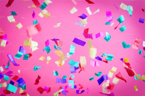 Falling confetti on pink background. ~ Holiday Photos ~ Creative Market