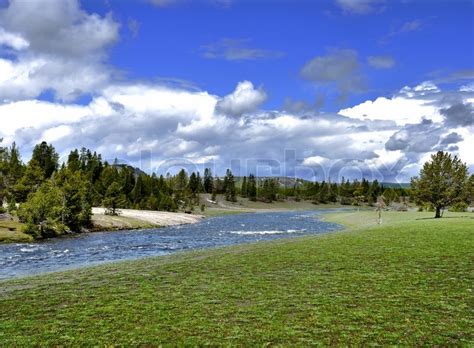 Mountain valley with river and trees ... | Stock image | Colourbox