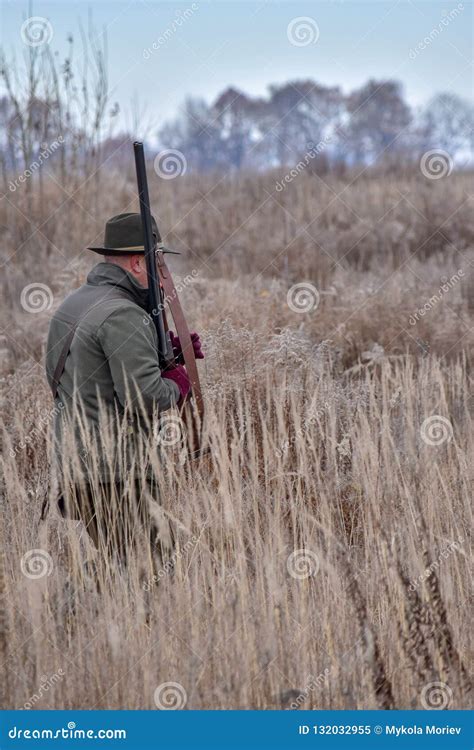 Bird Hunter with His Dog in the Field Editorial Image - Image of ...