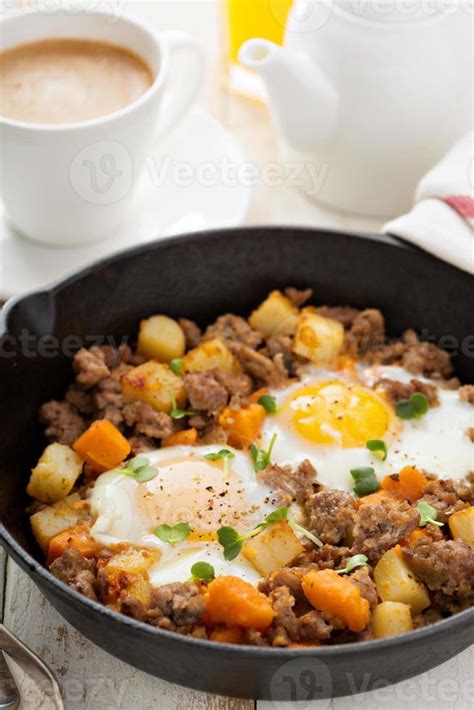 Potato hash with eggs 15704079 Stock Photo at Vecteezy