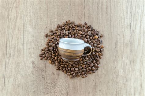 Brown Mug on Brown Coffee Beans · Free Stock Photo
