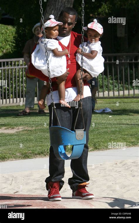 Sean 'P. Diddy' Combs plays with his twin daughters D'Lila Star Combs ...