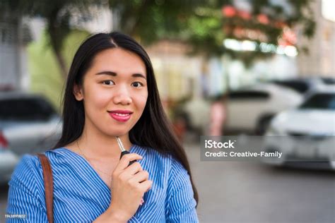 Asian Girl Holding A Car Key In The Parking Lot Stock Photo - Download Image Now - Adult, Adults ...