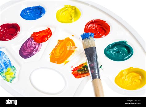 Paint palette with various acrylic paints and a brush Stock Photo - Alamy