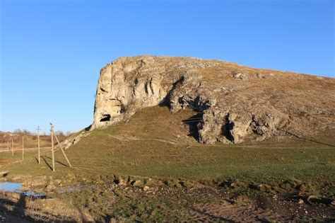 Premium Photo | A large rock formation in a field