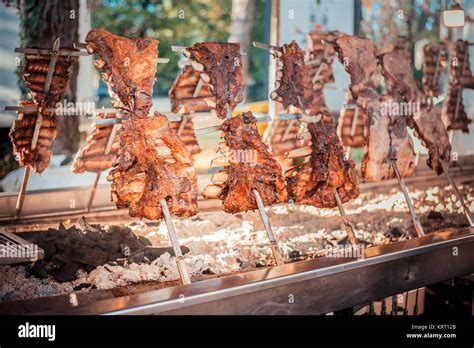 Traditional Argentinian asado roasted lamb grilled meat Stock Photo - Alamy