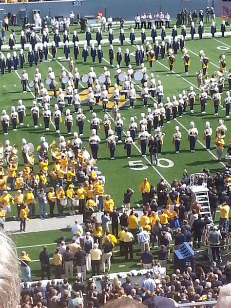 WVU Marching Band and Alumni Band on field during the National Anthem, Homecoming 2012. I am at ...