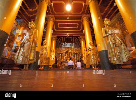 Two devotees inside Buddhist temple Shwedagon Pagoda Yangon Myanmar Stock Photo - Alamy