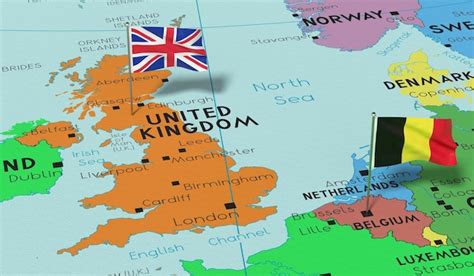 Premium Photo | United kingdom and belgium pin flags on political map 3d illustration