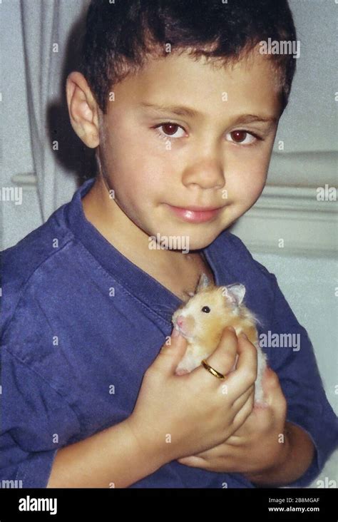 Young boy with hamster Stock Photo - Alamy