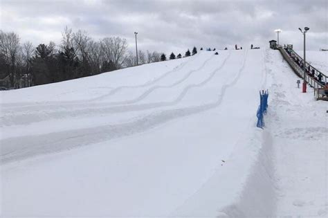 This groomed snow tubing slide is 600 feet of winter thrills at a ...