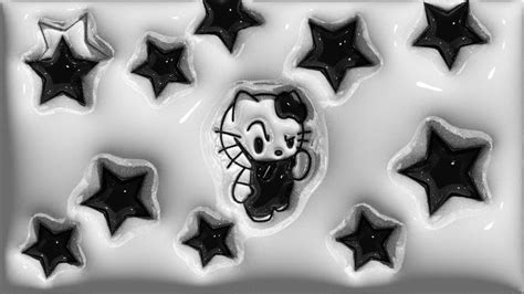 black and white photo of hello kitty cookies with stars around it in ...