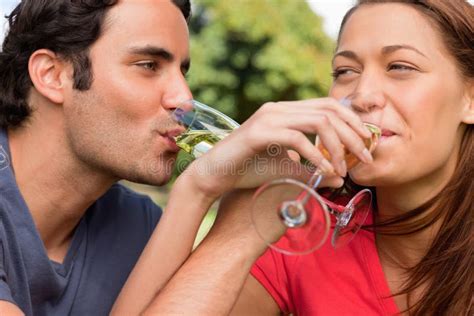 Two Friends Link Their Arms Together while Drinking Champagne Stock Image - Image of looking ...