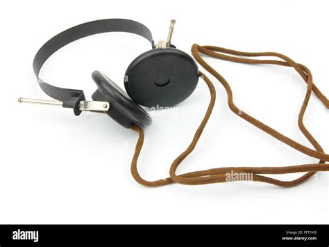 Old antique headphones with brown fabric cable Stock Photo - Alamy