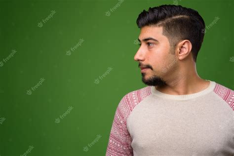 Premium Photo | Young bearded iranian man on green