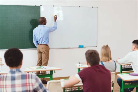 Teacher Writing On Board Stock Photos, Pictures & Royalty-Free Images - iStock