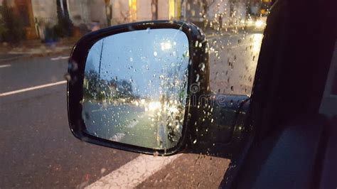 Rain Drop on Wing Car Mirror with Abstract Blurred of Light Traffic and ...