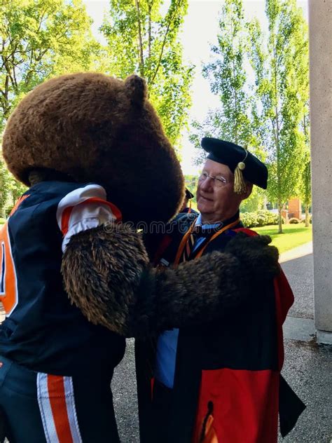 Oregon State University Mascot Benny Beaver Embraces President Ed Ray ...