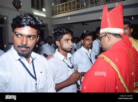 Catholic bishop is giving Confirmation sacrament Stock Photo - Alamy