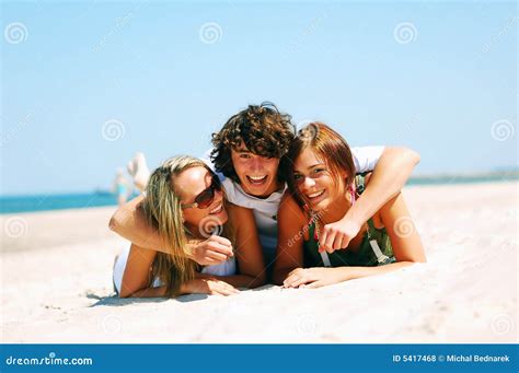 Young Friends on the Summer Beach Stock Photo - Image of beautiful, friends: 5417468