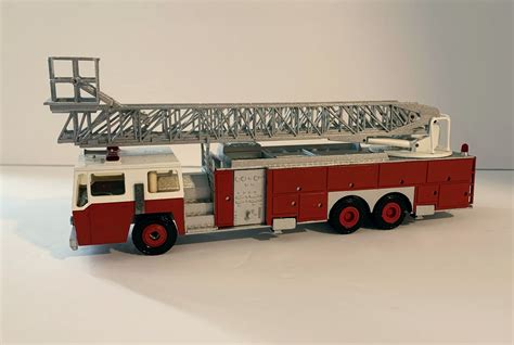 E-One 95' Aerial Ladder w/Bucket 3 Axle Fire Truck - The Fire Bell