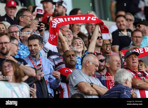 Brentford fans hold up their scarfs during the Premier League match ...