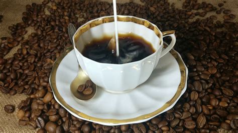 Pouring Milk Into The Cup Of Fresh Brewed Coffee In Slow Motion Stock Video Footage - Storyblocks
