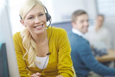 Connected and Ready To Assist. an Attractive Young Customer Service Representative Working at ...