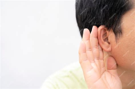 Premium Photo | Hearing test showing ear of young man with sound waves ...