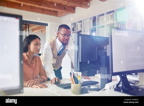 Business people using computer in office Stock Photo - Alamy