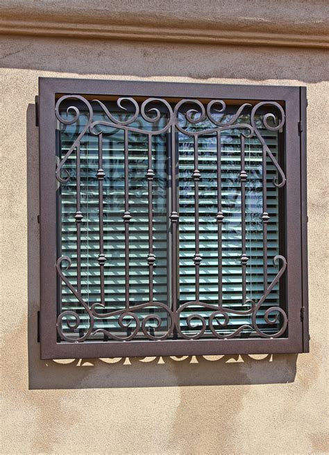 Hinged Iron Window Guard | First Impression Ironworks