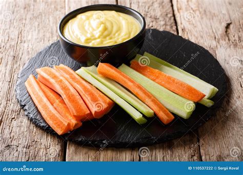 Fresh Crunchy Carrots and Celery with Cheese Dip on a Close-up. Stock ...