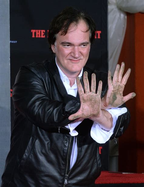 Quentin Tarantino leaves handprints, footprints at TCL Chinese Theatre ...