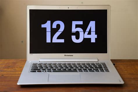 Turned-on Silver Lenovo Laptop Displaying Clock at 12:54 · Free Stock Photo