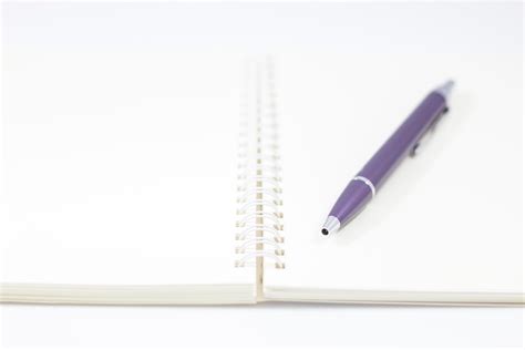 Spiral notebook with a pen 1740155 Stock Photo at Vecteezy