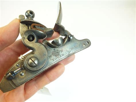 A RARE FLINTLOCK MECHANISM FROM A PATTERN 1833 OR MANTON CARBINE, the border engraved case colour