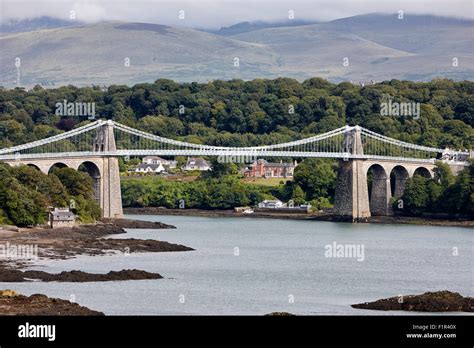 menai bridge across the menai strait between anglesey and north wales uk Stock Photo - Alamy