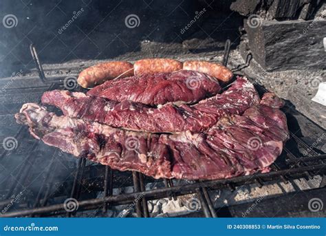 Typical Uruguayan and Argentine Asado Cooked on Fire. Entrana and Vacio ...