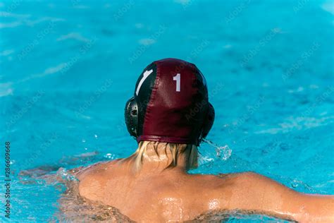 Water polo goalie number 1 treads water in swimming pool while wearing black uniform. Stock ...