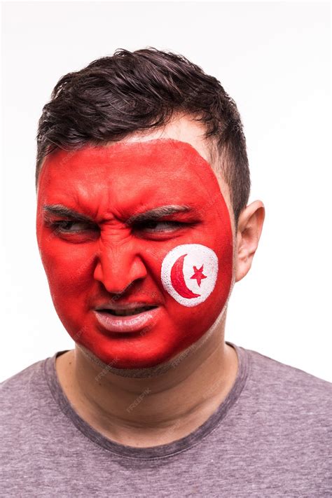 Free Photo | Face portrait of happy fan support tunisia national team with painted face isolated ...