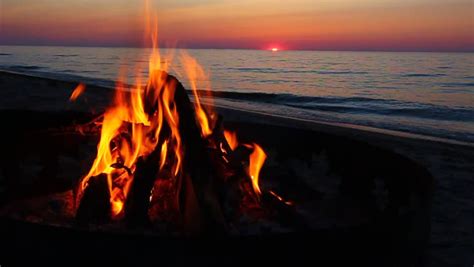 Campfire Burns Brightly at Sunset Stock Footage Video (100% Royalty ...