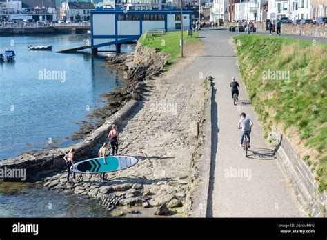 Cyclists young women board paddleboarding paddle boarding moored hi-res stock photography and ...