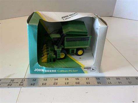 John Deere cotton picker - Legacy Auction Company