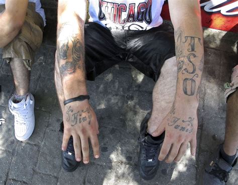 Street gangs tone down use of colors, tattoos to lower profile