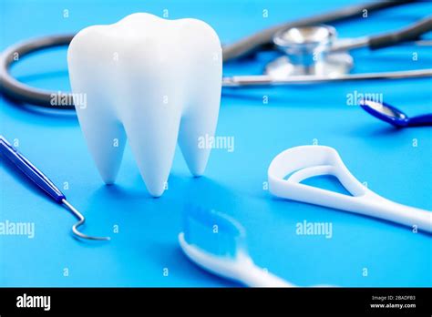 Dental model and dental equipment on blue background, concept image of ...