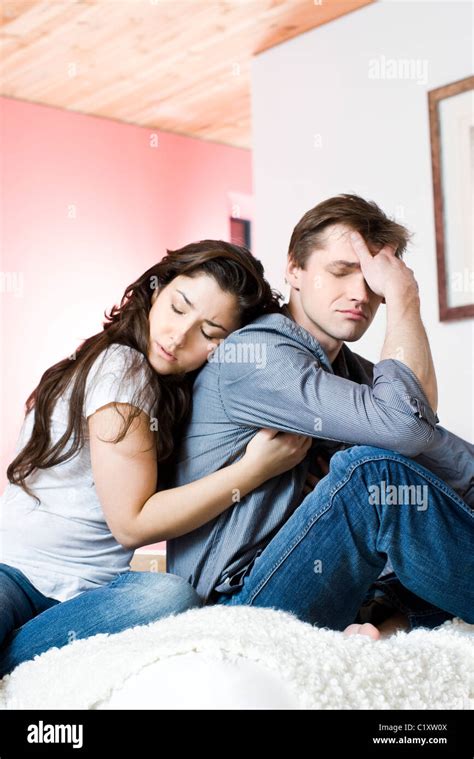 Woman hugging sad man Stock Photo - Alamy